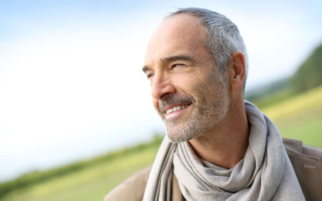 Portrait of a middle aged male smiling while outside