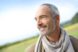 Portrait of a middle aged male smiling while outside